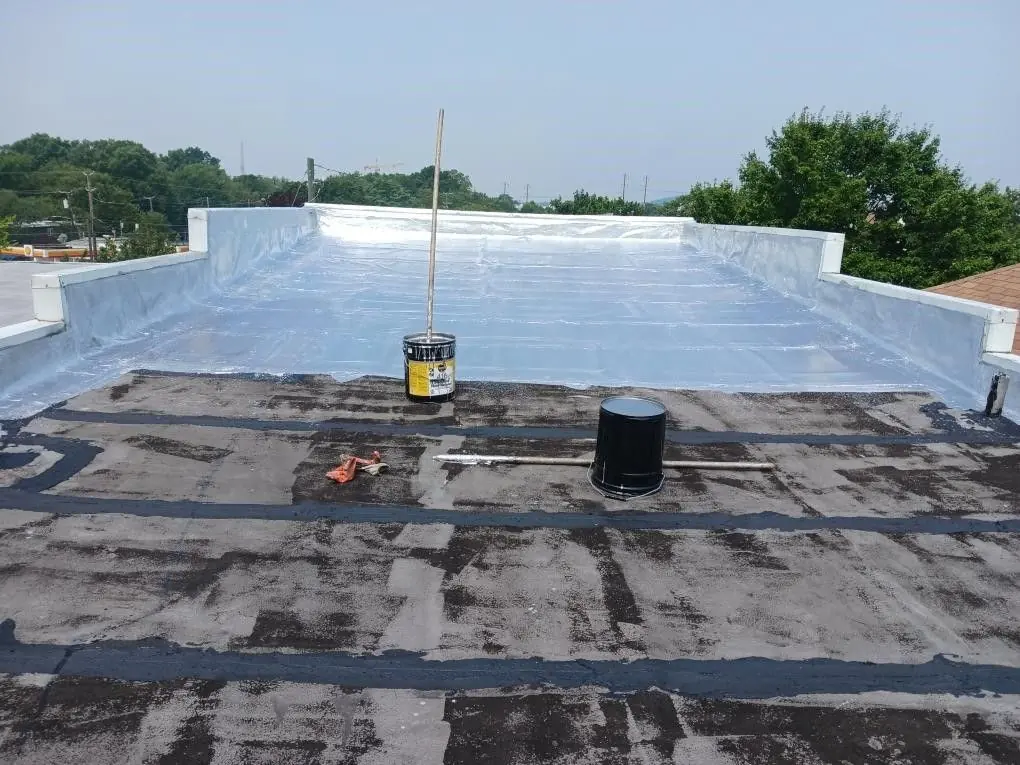 Flat roof prepared with primer before coating