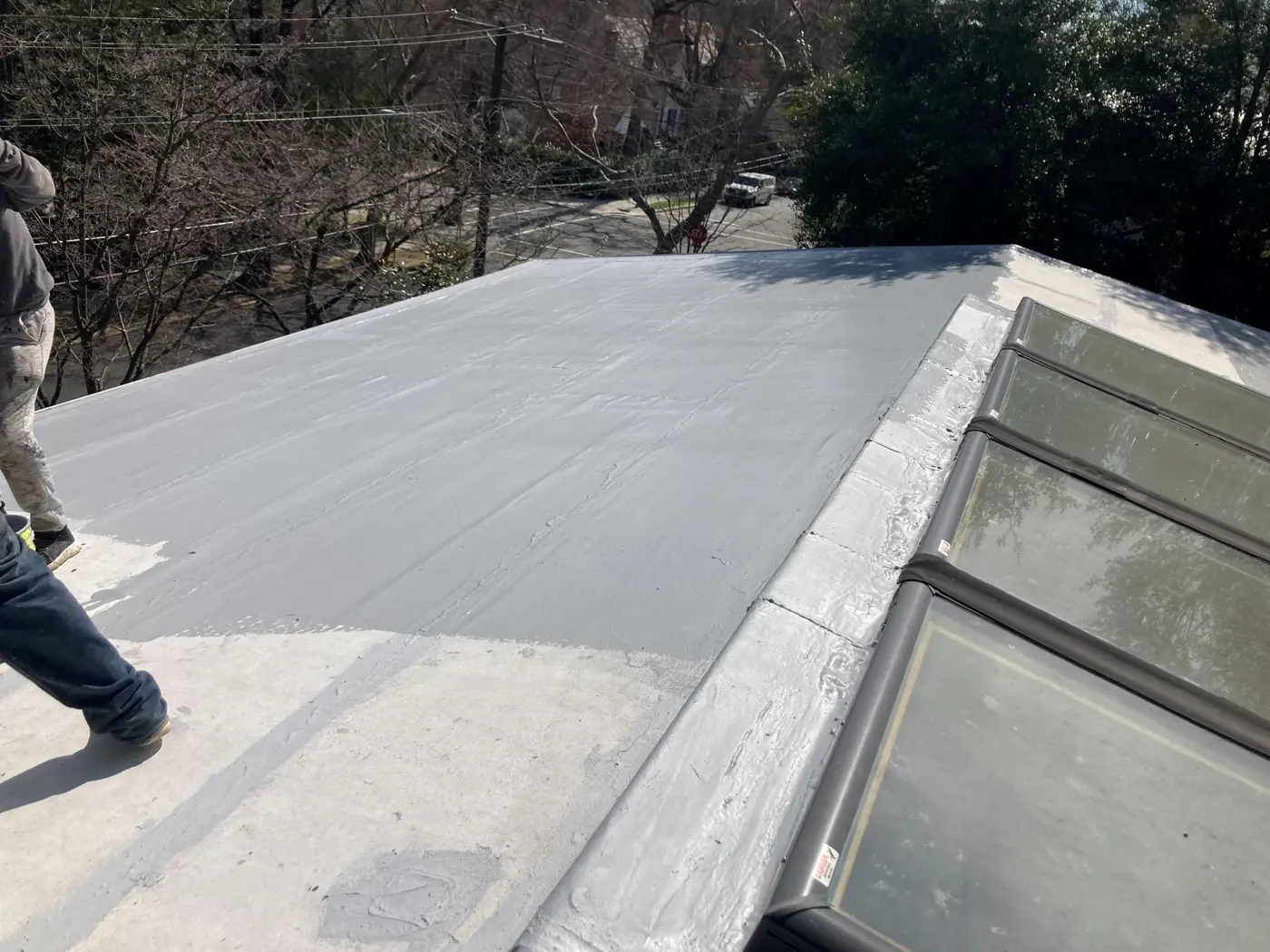 Freshly coated flat roof with skylights